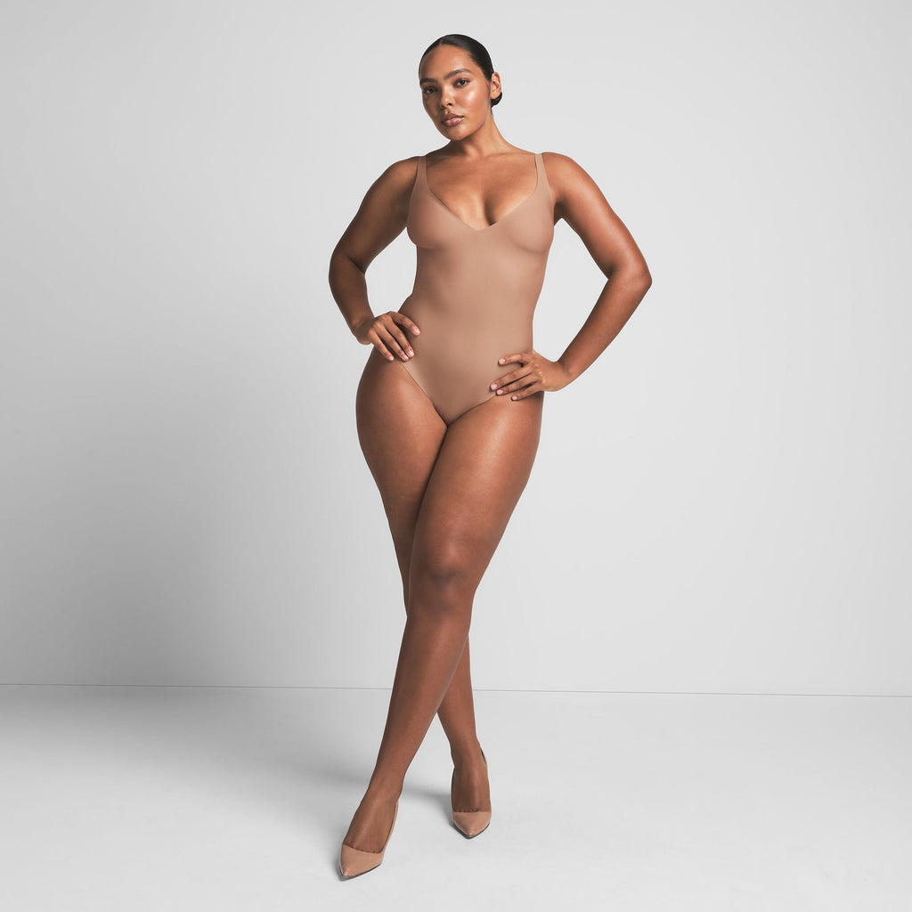 SKIMS BODY UNLINED PLUNGE THONG BODYSUIT | SIENNA
