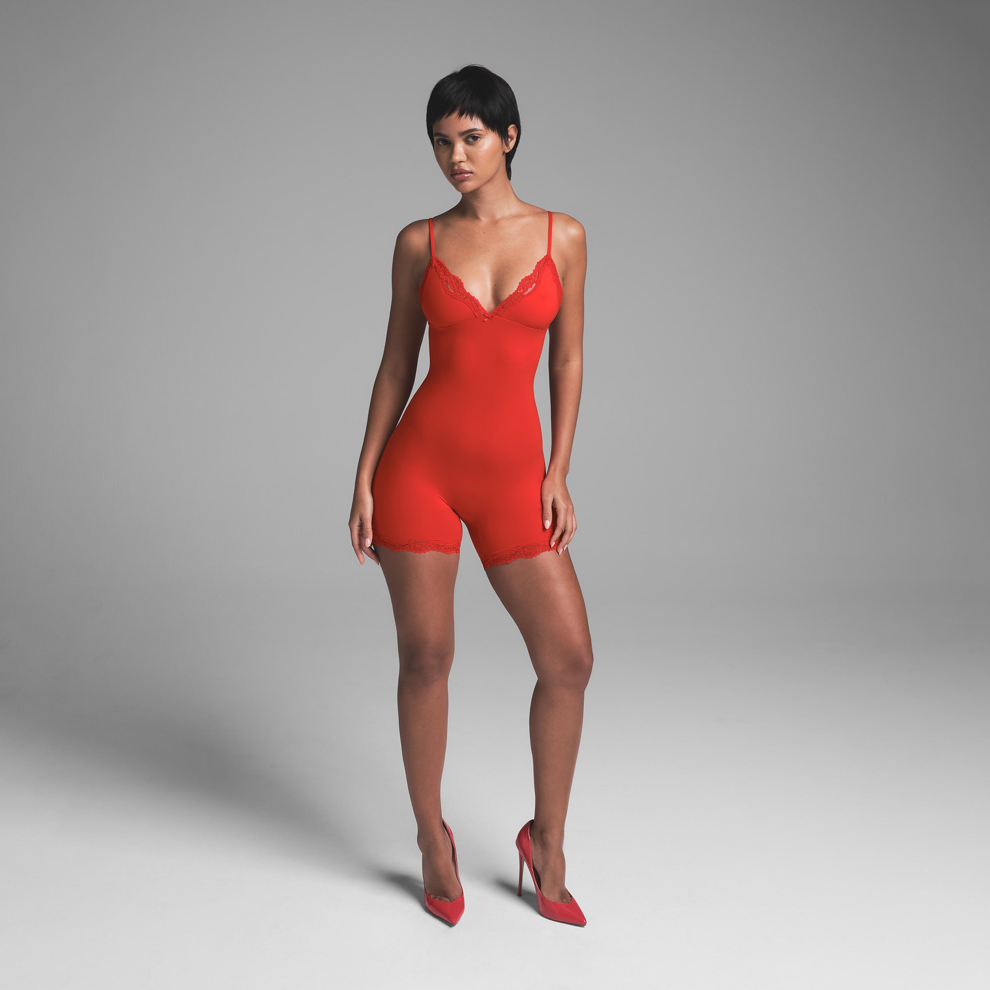 FITS EVERYBODY LACE TRIANGLE ONESIE | CAYENNE