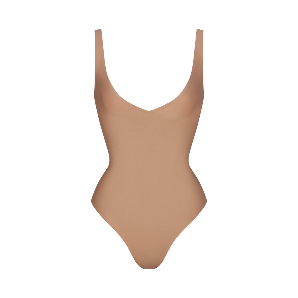 SKIMS BODY UNLINED PLUNGE THONG BODYSUIT | SIENNA